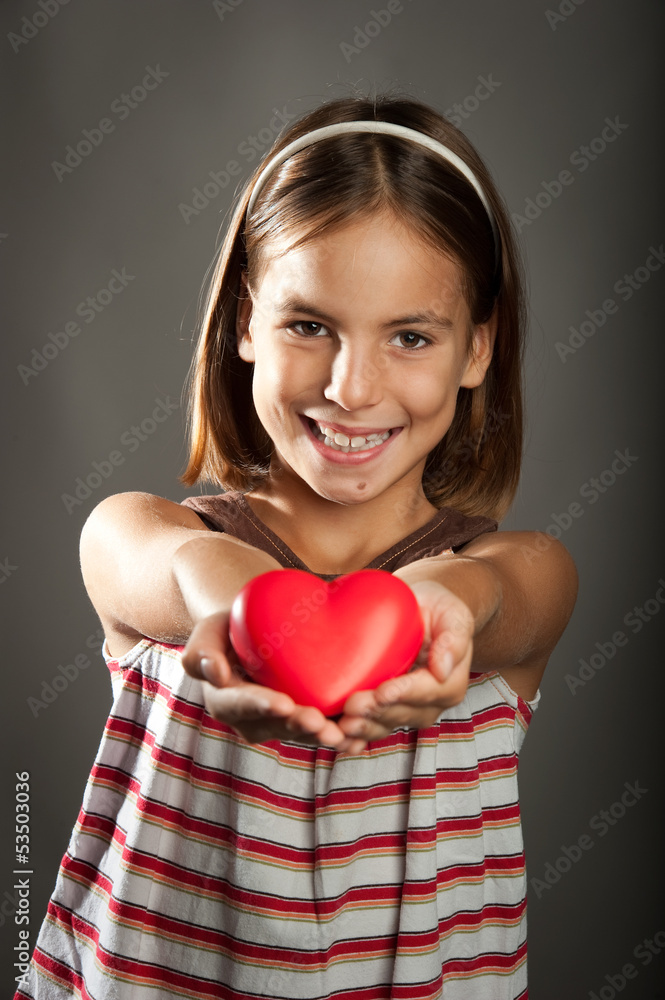 little girl with red heart