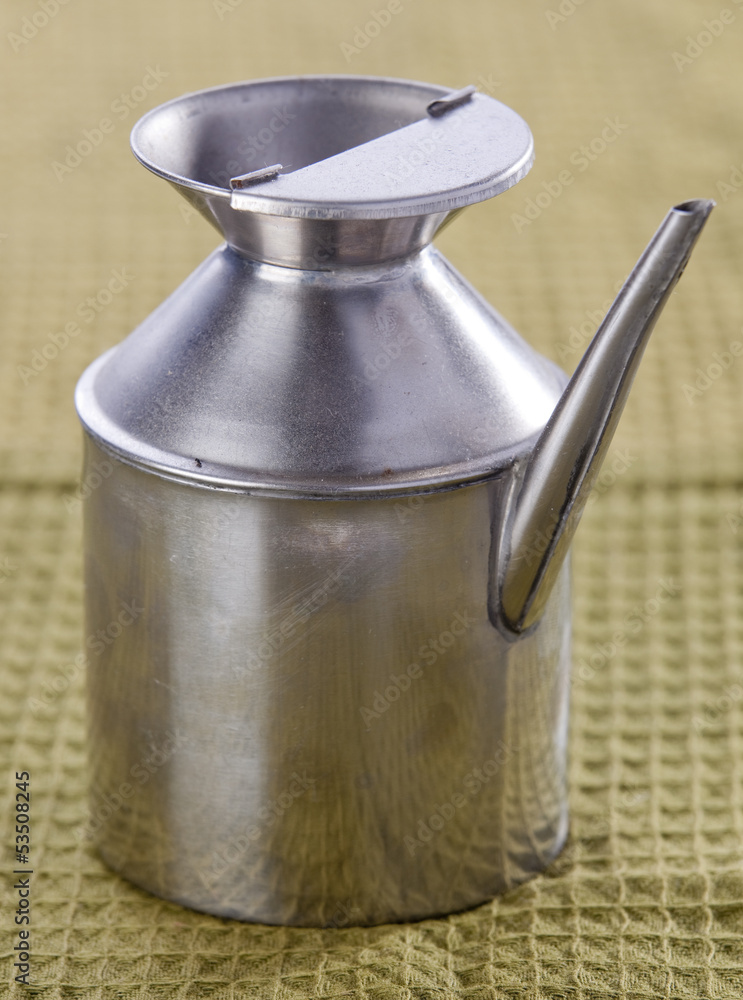 Old and used Stainless steel olive oil jug Old and used Stainless steel olive oil jug