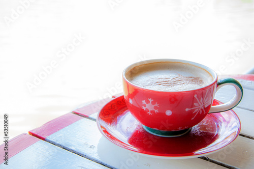 red coffee cup on table