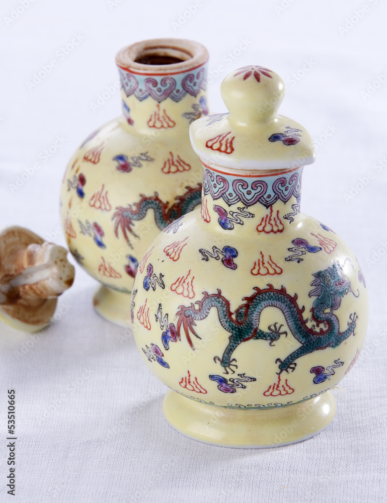 Two porcelain jugs from China, to store soya sauce