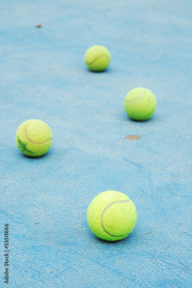 tennis balls on court field