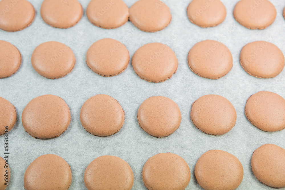 Baking French Macaron chocolate flavored cookies Baking French Macaron chocolate flavored cookies