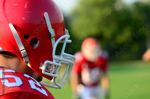 american football player wearing red helmet