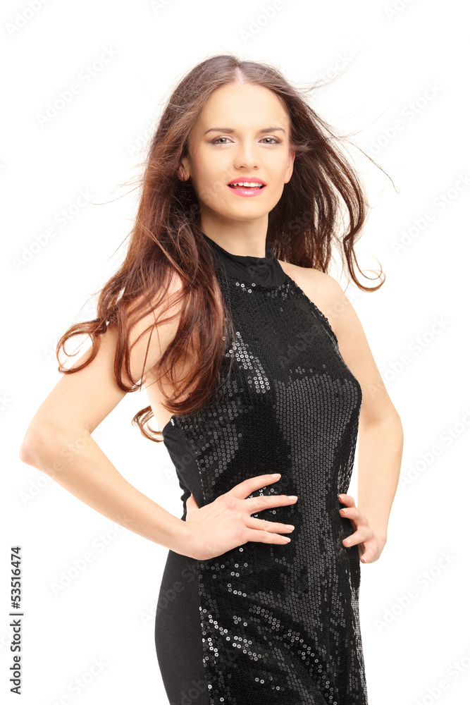 Young beautiful woman in a black dress looking at camera Young beautiful woman in a black dress looking at camera