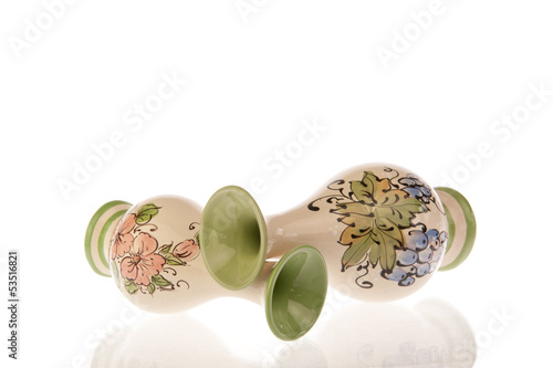 Two decorated vases fallen over