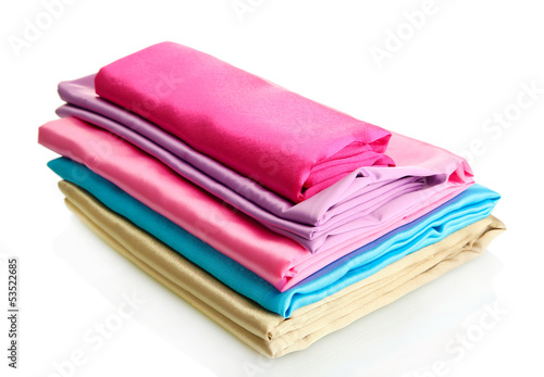 heap of cloth fabrics isolated on white