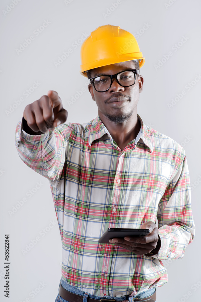 man in a helmet with a digital tablet man in a helmet with a digital tablet