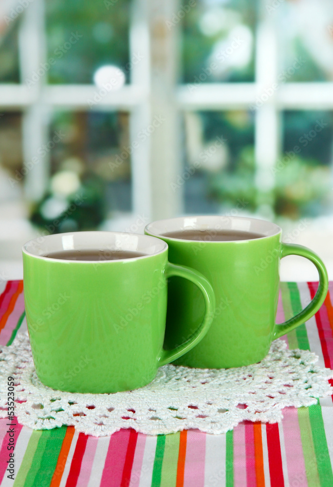 Cups of tea on table in room Cups of tea on table in room