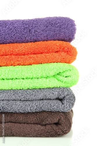 Pile of colorful towels, isolated on white
