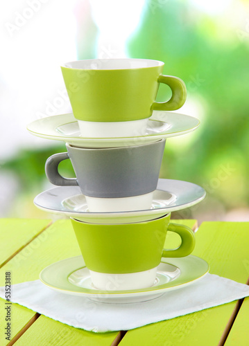 Plakat Three cups on nature background