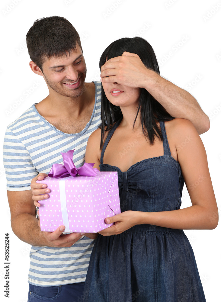 Beautiful loving couple with gift isolated on white Beautiful loving couple with gift isolated on white