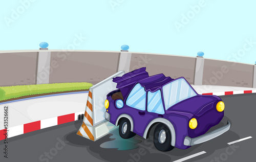 A violet car bumping the traffic cone at the road
