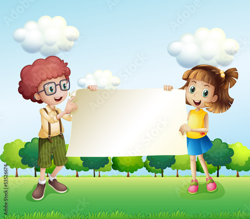 A boy and a girl holding an empty signage