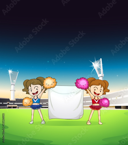 Cheerdancers holding an empty banner