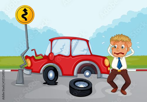 A worried man beside his damaged car