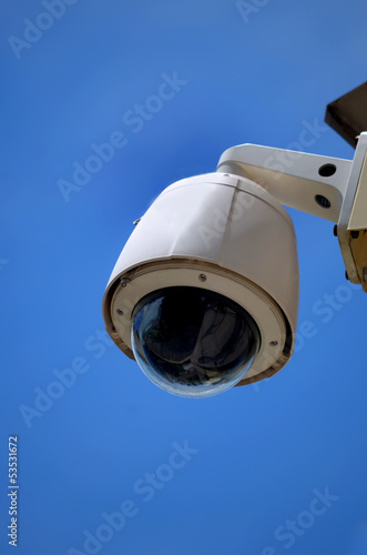 Hi-tech dome type camera on a blue sky