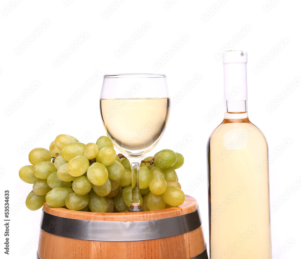 barrel, ripe grapes, glass and bottle of wine