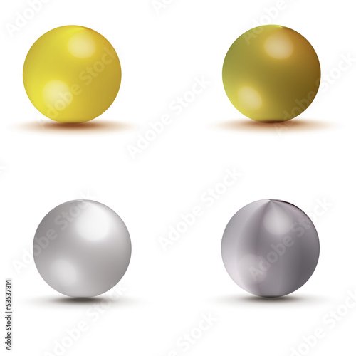 Collection of gold and silver spheres isolated on white