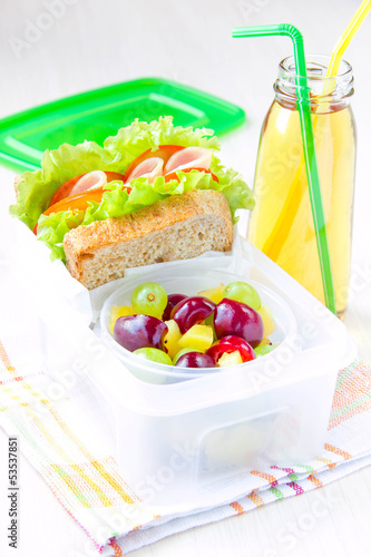 Bento lunch for child in school, box with sandwich and fruit