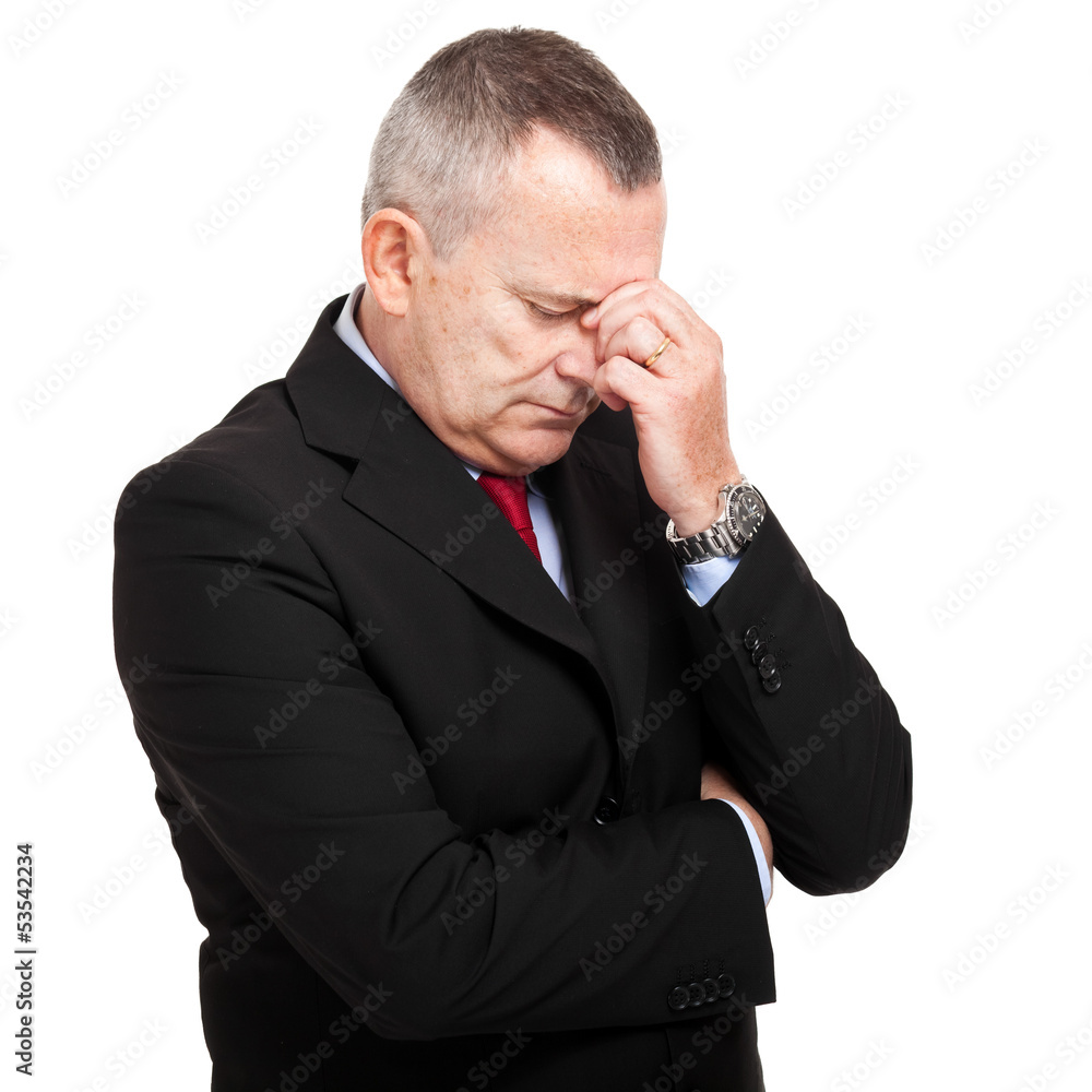 Portrait of a mature businessman looking depressed from work Portrait of a mature businessman looking depressed from work