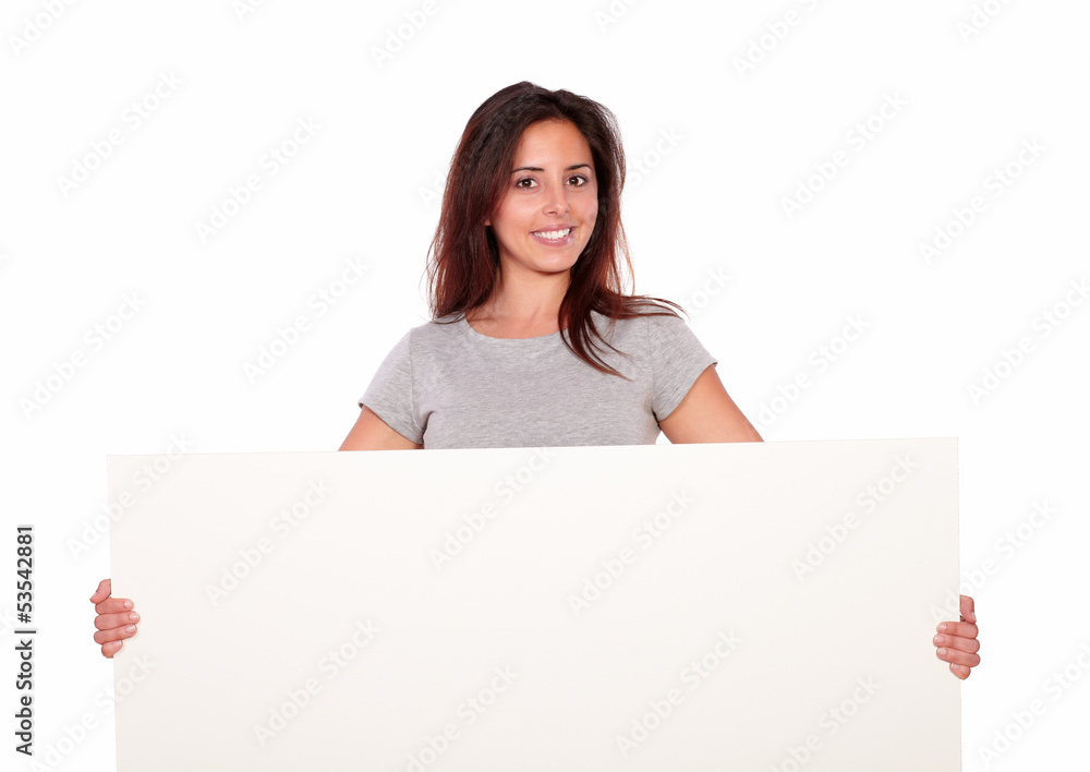 Smiling young woman holding a blank placard Smiling young woman holding a blank placard