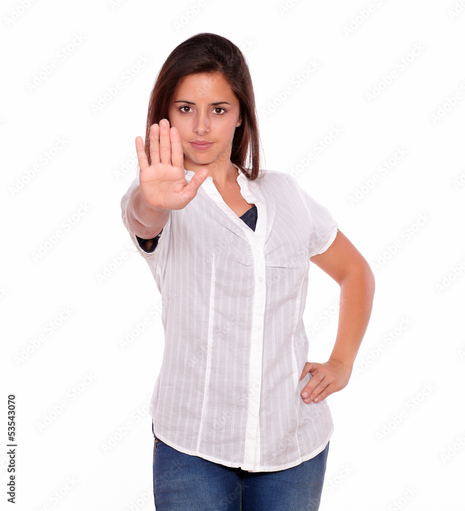 Hispanic young woman gesturing stop with hand Hispanic young woman gesturing stop with hand
