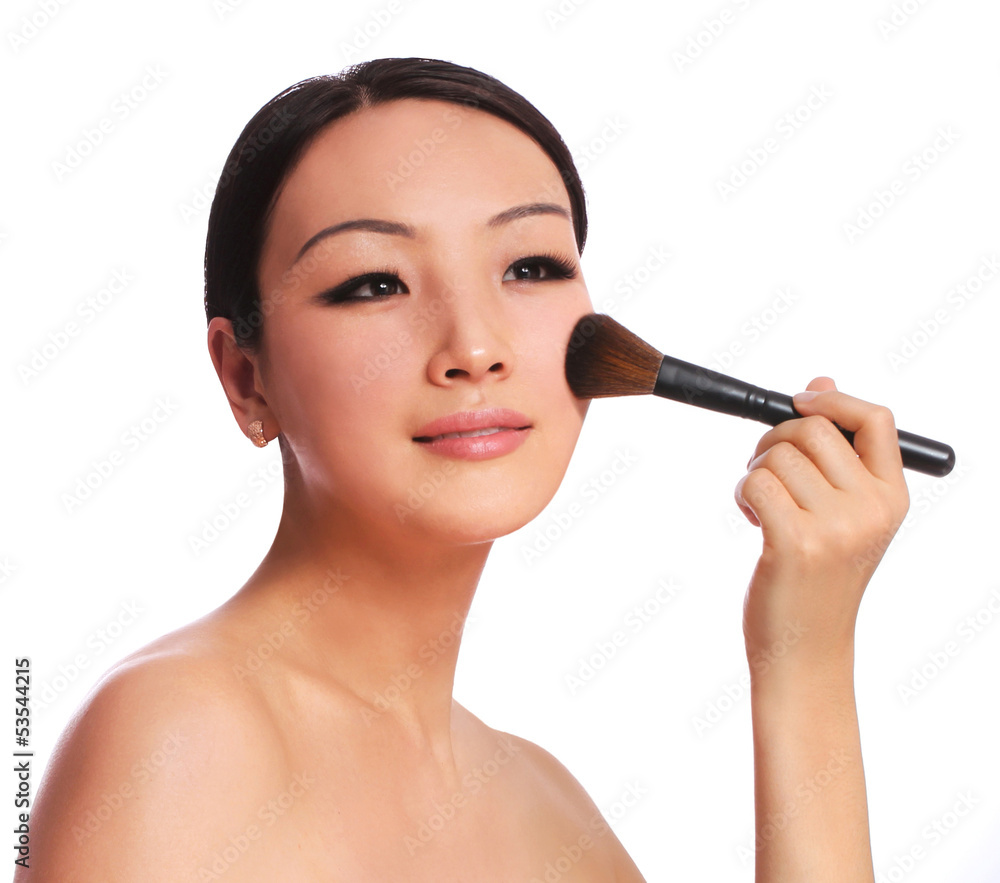 woman with makeup brush isolated on white woman with makeup brush isolated on white