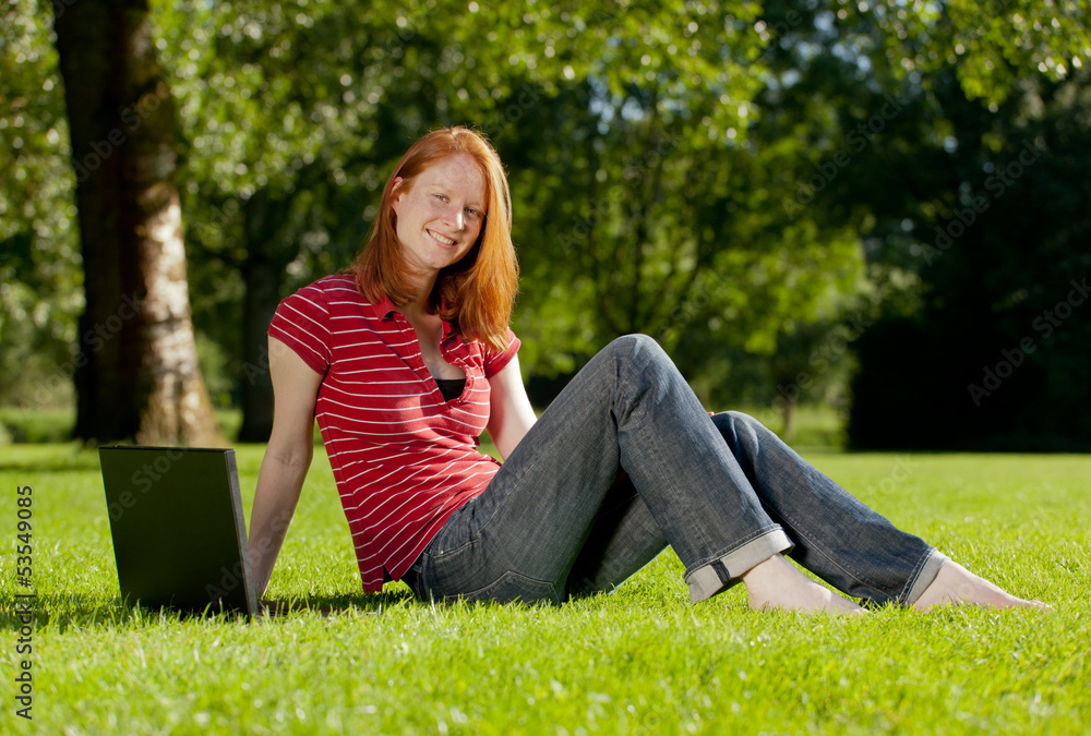 Obraz premium A young student in a park