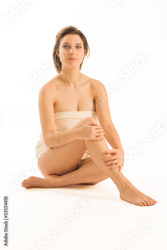 Healthy woman with beauty legs and towel