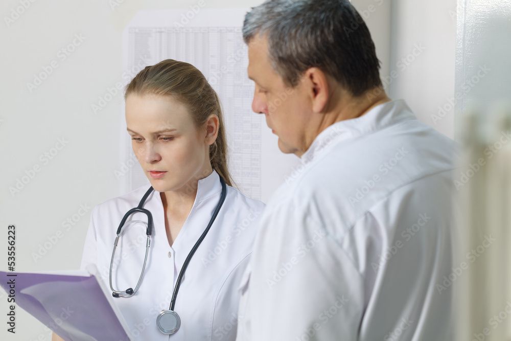 The nurse reported to doctor about medical tests. The nurse reported to doctor about medical tests.
