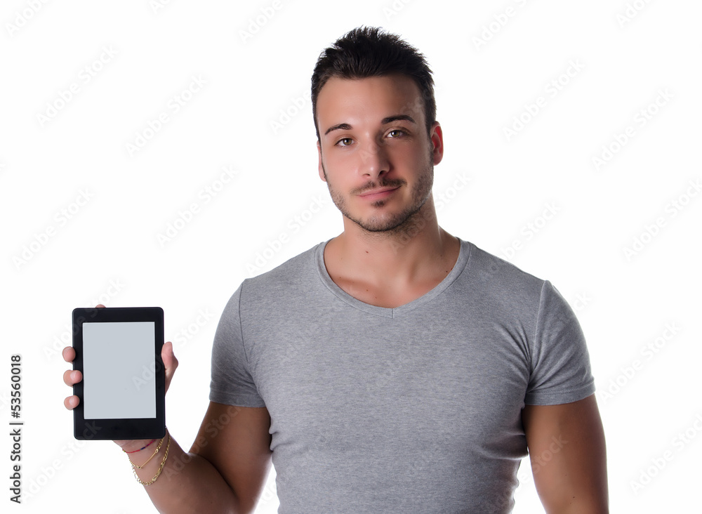 Attractive young man holding and showing ebook reader Attractive young man holding and showing ebook reader