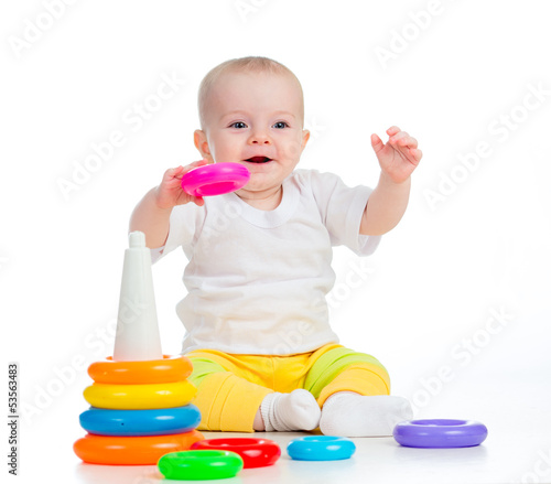 smiling baby playing with t...