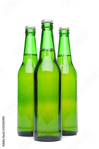 Three green beer bottles.