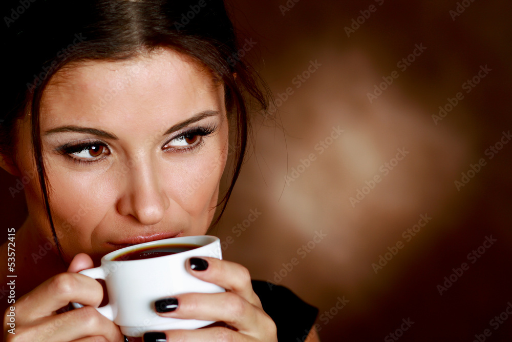 Woman with an aromatic coffee in hands Woman with an aromatic coffee in hands