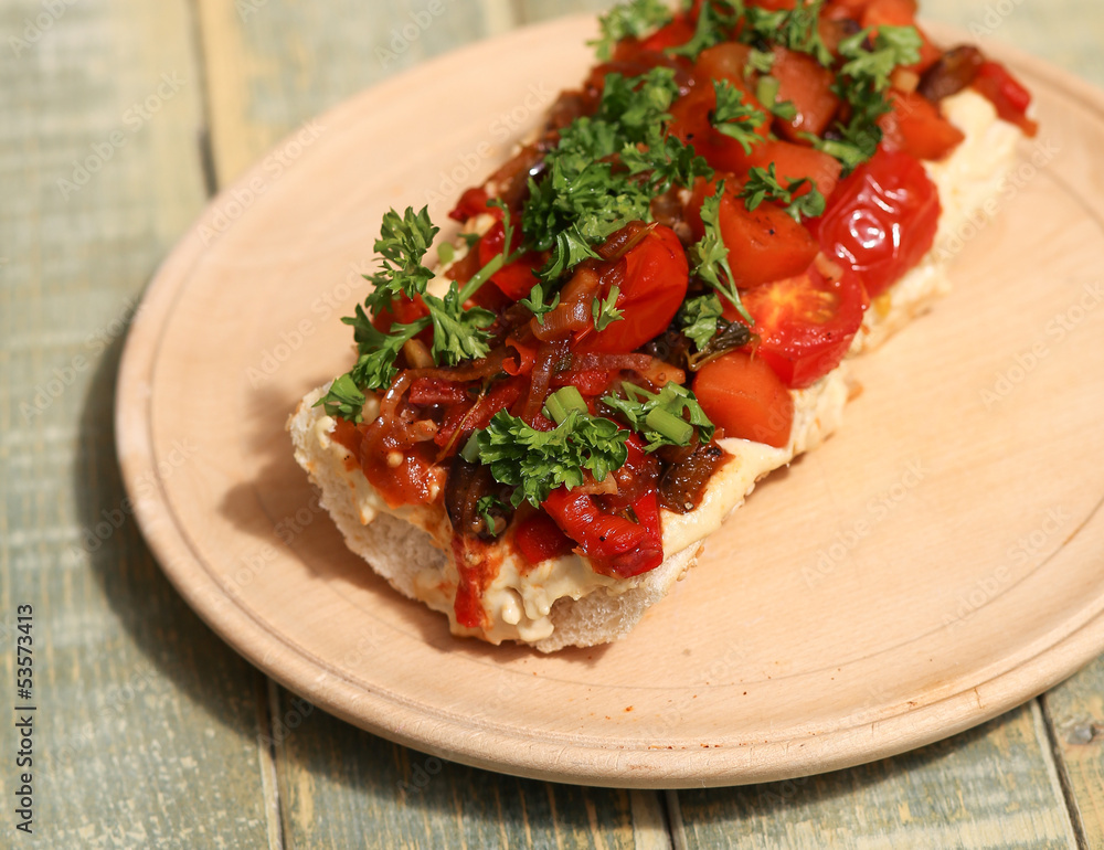 Baguette with roasted vegetables and hummus Baguette with roasted vegetables and hummus