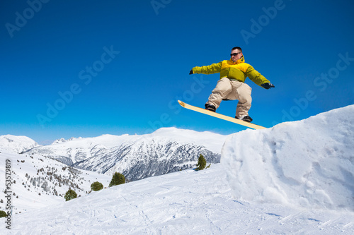 Cute snowboard man jumping