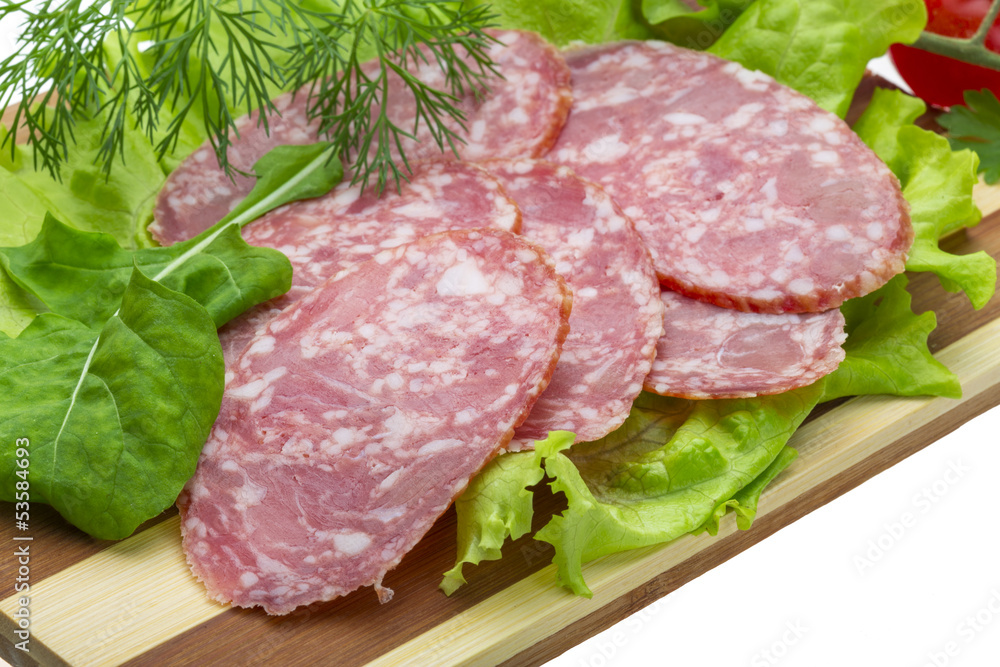 Fototapeta premium Sausages with salad and basil