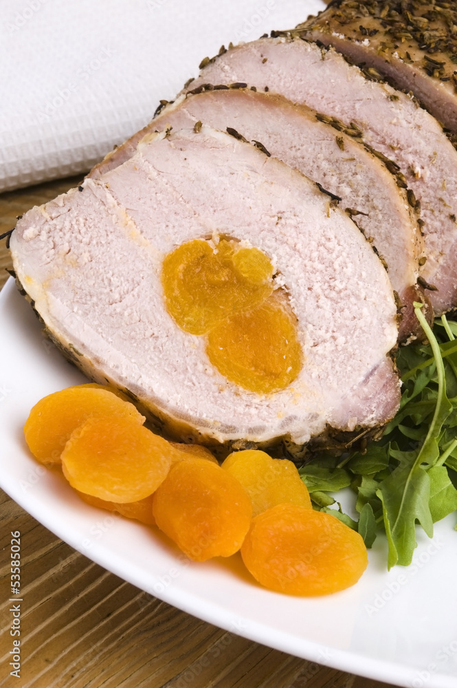 Fototapeta premium Roasted pork loin with dried apricots