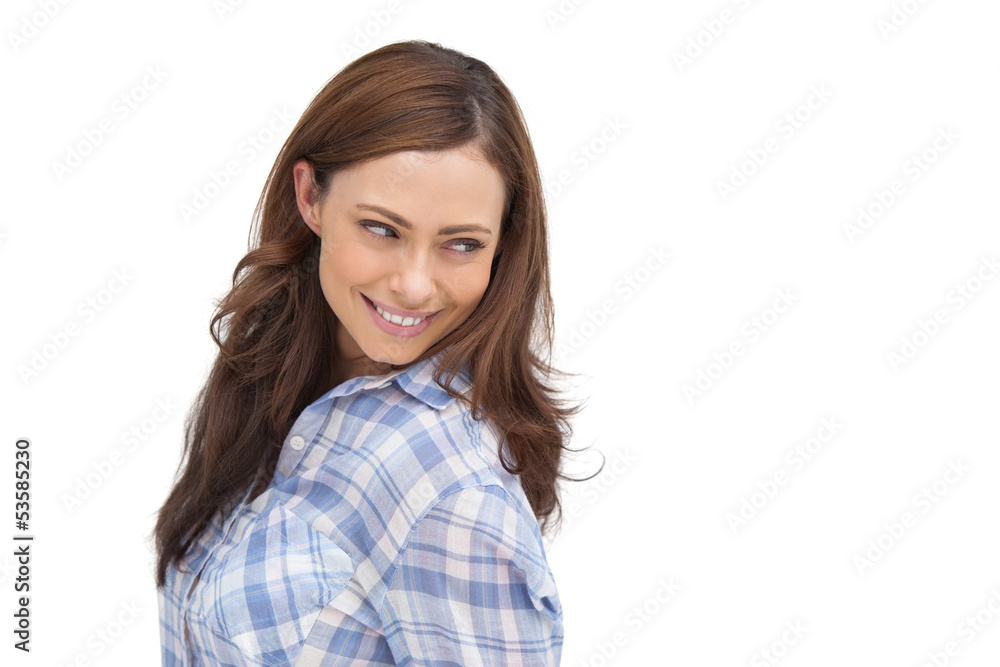 Smiling woman looking something behind her Smiling woman looking something behind her