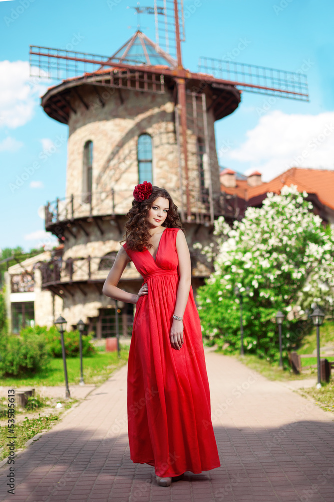 Beautiful woman in a bright red dress Beautiful woman in a bright red dress