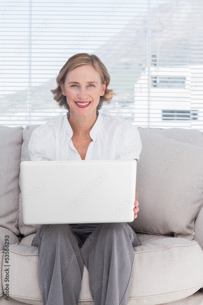 Portait of a smiling businesswoman using a laptop Portait of a smiling businesswoman using a laptop
