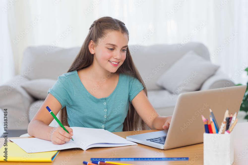 Little girl doing her homework at home Little girl doing her homework at home