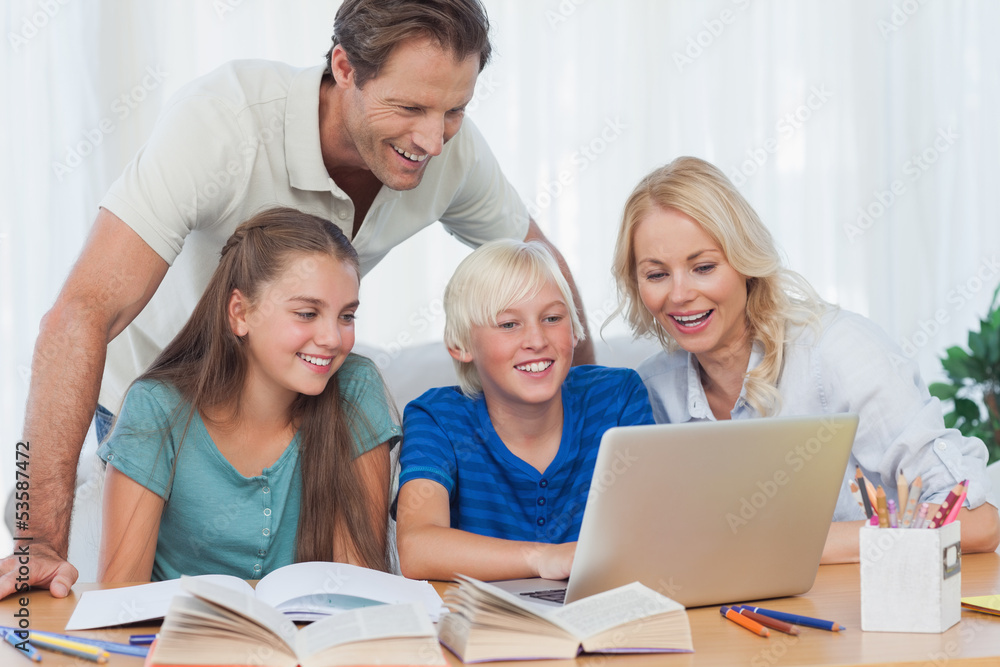 Parents and children using a computer Parents and children using a computer