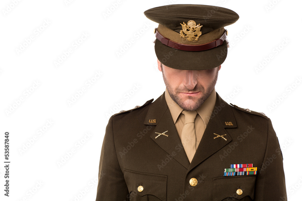 Army man looking down, filled with shame. Army man looking down, filled with shame.