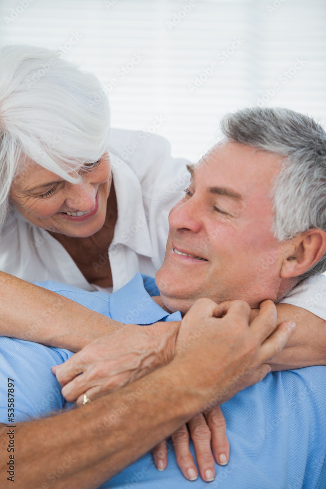 Fototapeta premium White haired woman hugging husband