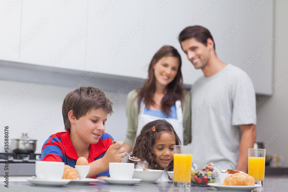 Children having breakfast in kitchen Children having breakfast in kitchen