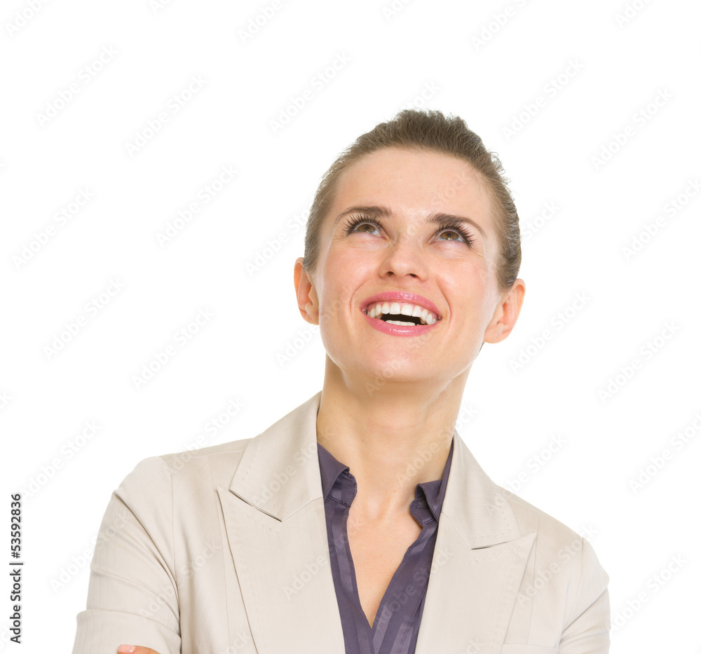 Happy business woman looking up on copy space Happy business woman looking up on copy space