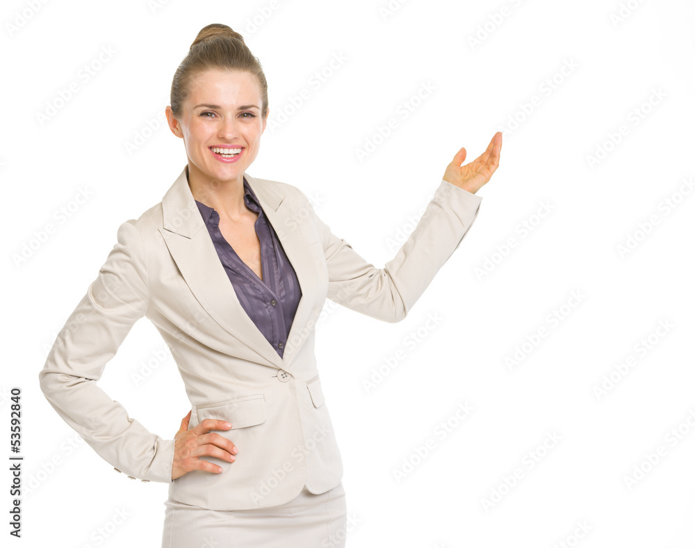Smiling business woman pointing on copy space Smiling business woman pointing on copy space