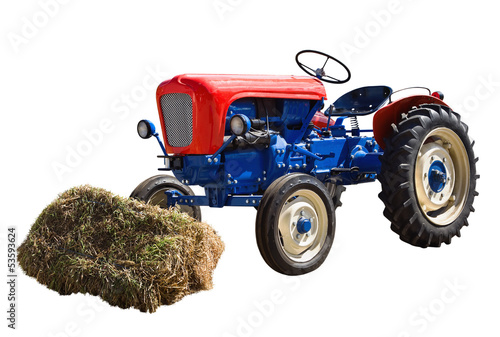 old tractor and a shock of hay