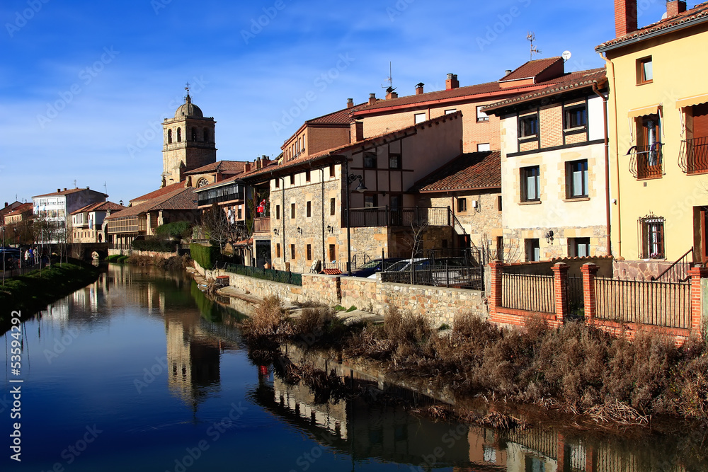 Landscape of river and village in Aguilar de Campo, famous for i